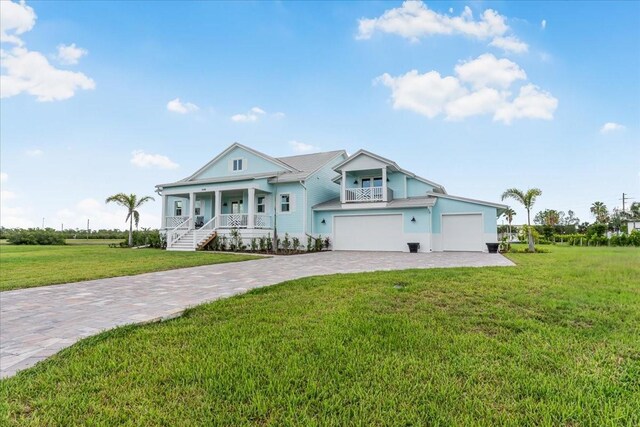 3548 Mondovi Ct, Punta Gorda, FL 33950 - view of front facade with a porch, decorative driveway, and a front yard
