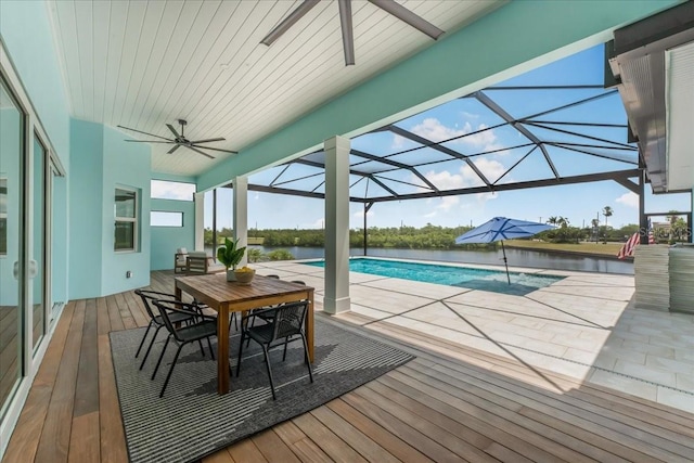 3548 Mondovi Ct, Punta Gorda, FL 33950 - swimming pool with ceiling fan, outdoor dining space, a patio, and a deck with water view