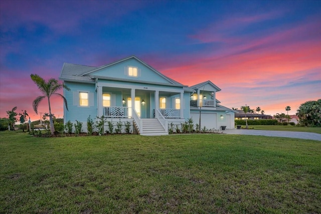 3548 Mondovi Ct, Punta Gorda, FL 33950 - greek revival house featuring covered porch, driveway, and a front lawn