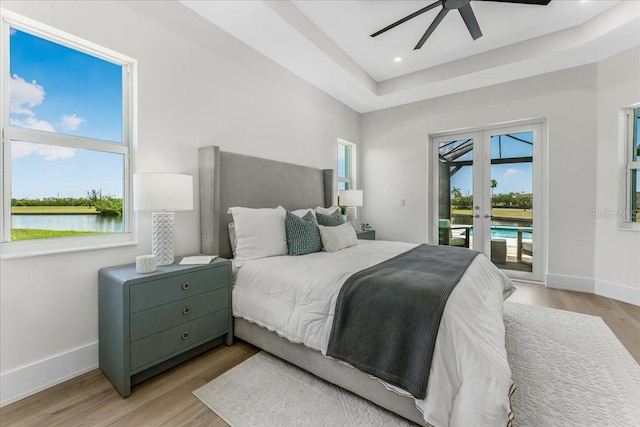 3548 Mondovi Ct, Punta Gorda, FL 33950 - bedroom featuring access to exterior, french doors, light wood-type flooring, a ceiling fan, and recessed lighting