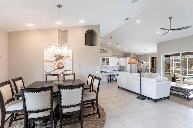 523 Saint Girons Ct, Punta Gorda, FL 33950 - dining space with a chandelier, a ceiling fan, light tile patterned floors, recessed lighting, and high vaulted ceiling