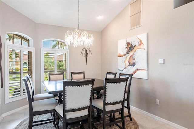 523 Saint Girons Ct, Punta Gorda, FL 33950 - dining area featuring a chandelier, baseboards, and light tile patterned flooring