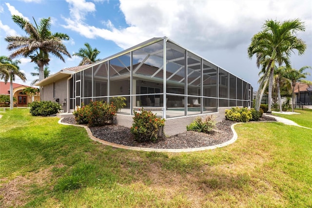 523 Saint Girons Ct, Punta Gorda, FL 33950 - back of house featuring a yard, stucco siding, and a lanai