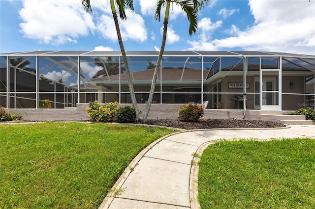 523 Saint Girons Ct, Punta Gorda, FL 33950 - back of house featuring a lawn and a lanai