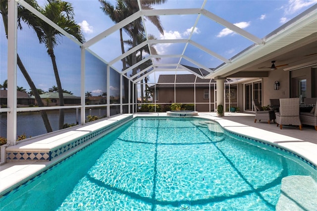 523 Saint Girons Ct, Punta Gorda, FL 33950 - view of swimming pool with a patio area, a ceiling fan, a pool with connected hot tub, and glass enclosure