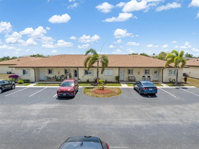 25275 Rampart Blvd Unit 1504, Punta Gorda, FL 33983 - view of front of home with uncovered parking and stucco siding
