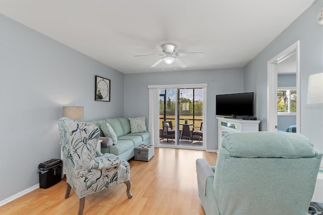 25275 Rampart Blvd Unit 1504, Punta Gorda, FL 33983 - living room with light wood-style floors, ceiling fan, and baseboards