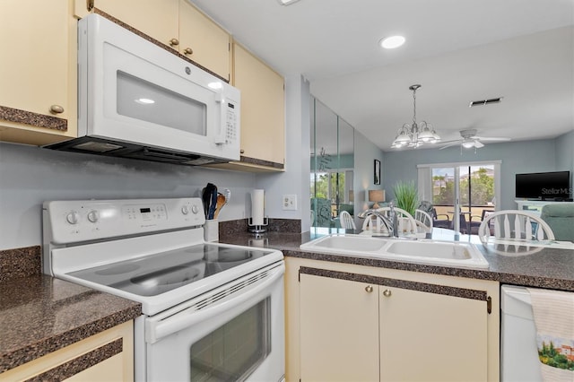 25275 Rampart Blvd Unit 1504, Punta Gorda, FL 33983 - kitchen featuring white appliances, a sink, open floor plan, dark countertops, and ceiling fan