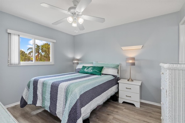25275 Rampart Blvd Unit 1504, Punta Gorda, FL 33983 - bedroom with wood finished floors, baseboards, and a ceiling fan