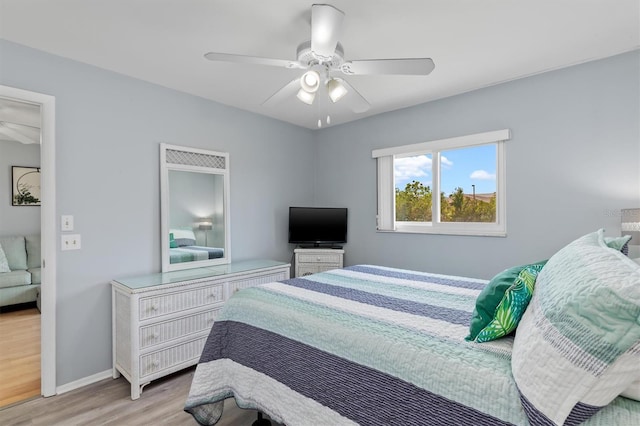 25275 Rampart Blvd Unit 1504, Punta Gorda, FL 33983 - bedroom with light wood-style floors, baseboards, and ceiling fan