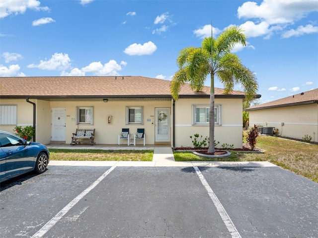 25275 Rampart Blvd Unit 1504, Punta Gorda, FL 33983 - multi unit property featuring stucco siding, uncovered parking, and central AC unit