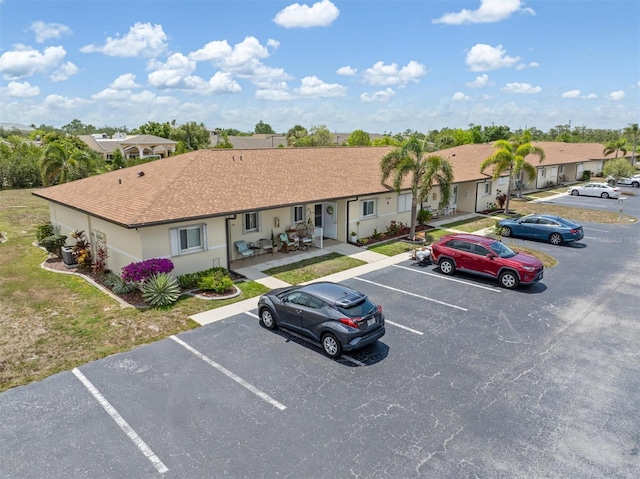 25275 Rampart Blvd Unit 1504, Punta Gorda, FL 33983 - view of front of home featuring uncovered parking, stucco siding, and a residential view