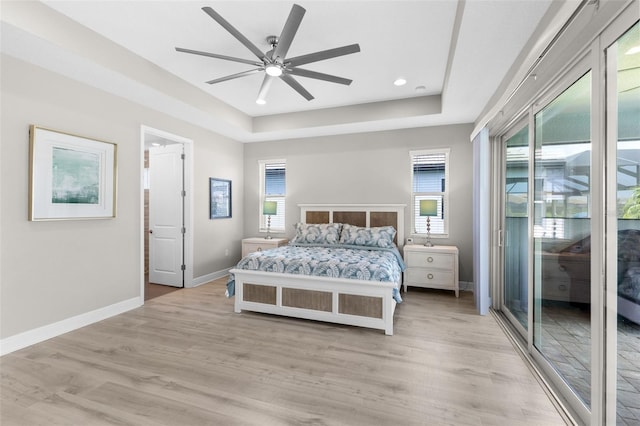 19821 Montenero Way, Venice, FL 34293 - bedroom featuring multiple windows, baseboards, access to exterior, light wood-style floors, and recessed lighting