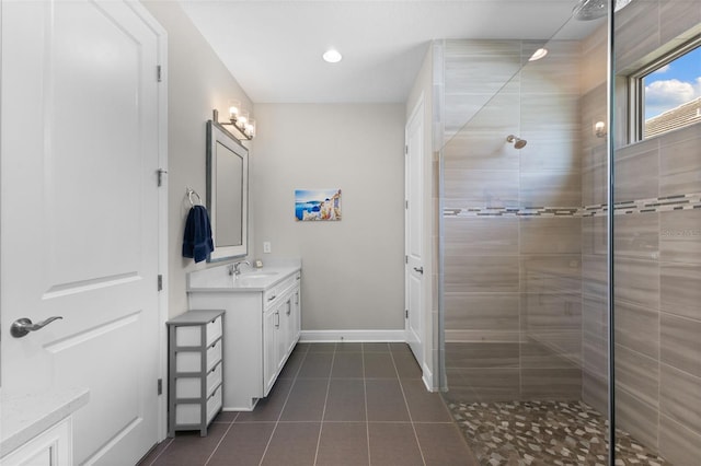 19821 Montenero Way, Venice, FL 34293 - full bath featuring vanity, tile patterned floors, a tile shower, baseboards, and recessed lighting
