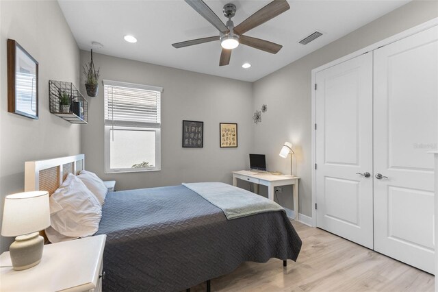19821 Montenero Way, Venice, FL 34293 - bedroom featuring light wood-style flooring, recessed lighting, a ceiling fan, a closet, and baseboards