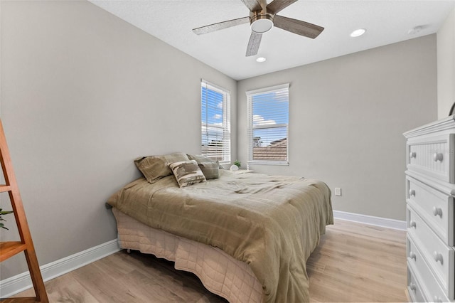 19821 Montenero Way, Venice, FL 34293 - bedroom with light wood-style flooring, baseboards, ceiling fan, and recessed lighting