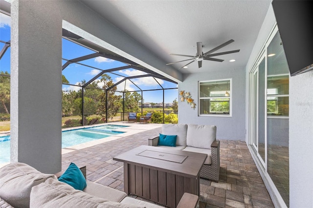 19821 Montenero Way, Venice, FL 34293 - view of patio / terrace with an outdoor living space, a ceiling fan, an outdoor pool, and a lanai