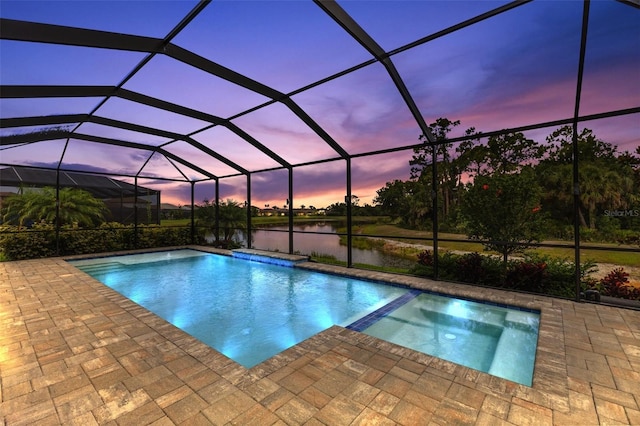 19821 Montenero Way, Venice, FL 34293 - view of swimming pool featuring a patio area, a water view, a pool with connected hot tub, and a lanai