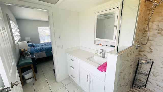 24239 Yacht Club Blvd, Punta Gorda, FL 33955 - ensuite bathroom with tiled shower, vanity, and tile patterned flooring