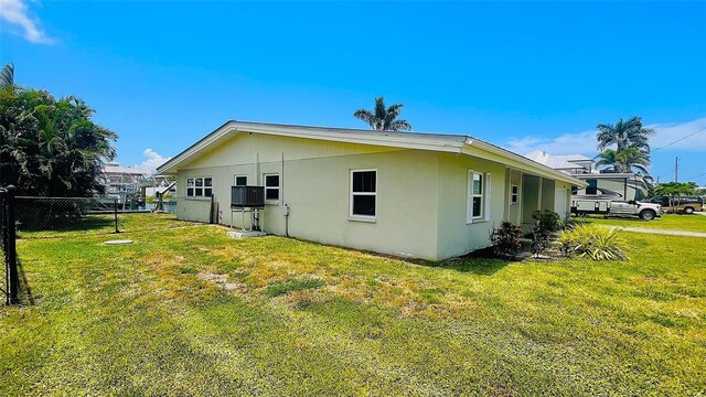 24239 Yacht Club Blvd, Punta Gorda, FL 33955 - view of side of home featuring stucco siding