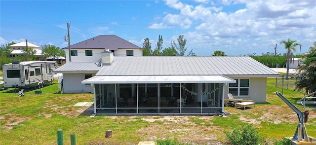 24239 Yacht Club Blvd, Punta Gorda, FL 33955 - back of house with a sunroom and a metal roof