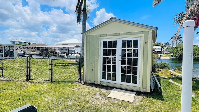 24239 Yacht Club Blvd, Punta Gorda, FL 33955 - view of outbuilding with a gate and a water view