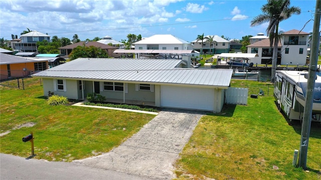 24239 Yacht Club Blvd, Punta Gorda, FL 33955 - view of front of property with a metal roof, stucco siding, a residential view, an attached garage, and a standing seam roof