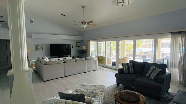 2399 Bendway Dr, Port Charlotte, FL 33948 - living room featuring lofted ceiling, ceiling fan, and light wood-style flooring
