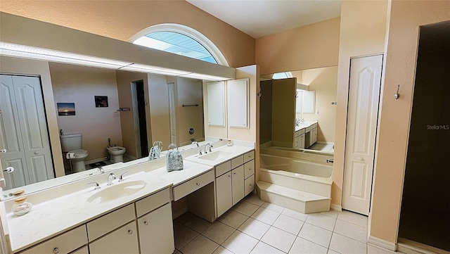 2399 Bendway Dr, Port Charlotte, FL 33948 - bathroom featuring a garden tub, double vanity, tile patterned floors, toilet, and a bidet