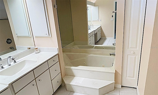 2399 Bendway Dr, Port Charlotte, FL 33948 - bathroom featuring vanity, a tub with jets, and tile patterned flooring