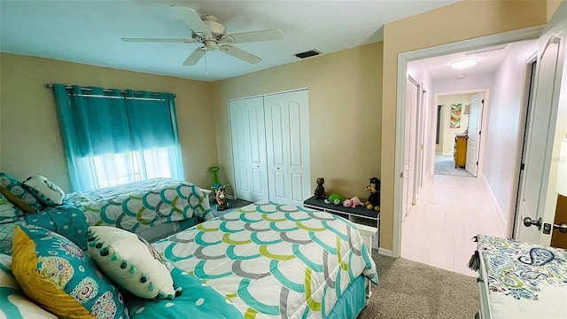 2399 Bendway Dr, Port Charlotte, FL 33948 - bedroom with a closet, a ceiling fan, light colored carpet, and baseboards