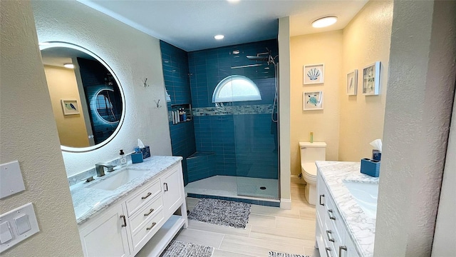 2399 Bendway Dr, Port Charlotte, FL 33948 - bathroom featuring vanity, toilet, a shower stall, a textured wall, and tile patterned flooring