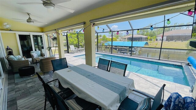 2399 Bendway Dr, Port Charlotte, FL 33948 - swimming pool featuring a patio, a ceiling fan, a lanai, and outdoor dining area