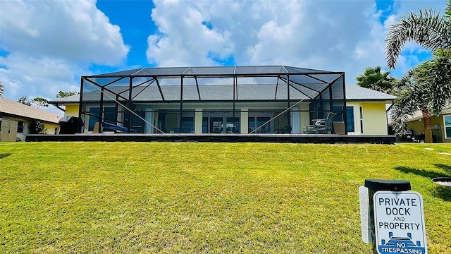 2399 Bendway Dr, Port Charlotte, FL 33948 - rear view of house with a yard and glass enclosure