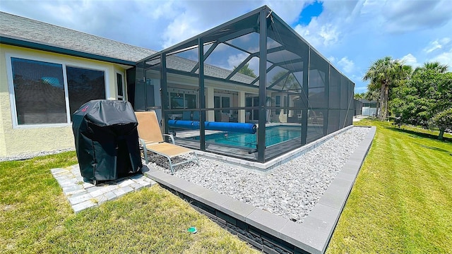 2399 Bendway Dr, Port Charlotte, FL 33948 - back of house featuring a covered pool, a yard, a patio area, and glass enclosure