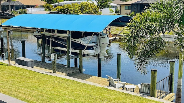 2399 Bendway Dr, Port Charlotte, FL 33948 - dock area featuring boat lift, a water view, and a lawn