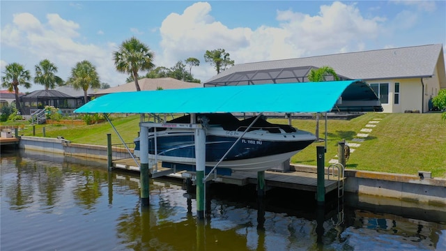 2399 Bendway Dr, Port Charlotte, FL 33948 - dock area with boat lift, a water view, and a lawn