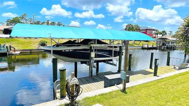 2399 Bendway Dr, Port Charlotte, FL 33948 - dock with boat lift, a water view, and a yard