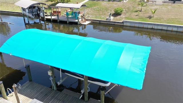 2399 Bendway Dr, Port Charlotte, FL 33948 - dock featuring boat lift and a water view
