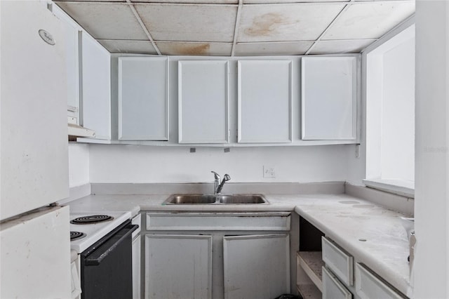 1515 Paul Russell Rd # 64, Tallahassee, FL 32301 - kitchen with electric range, a sink, white cabinetry, and light countertops