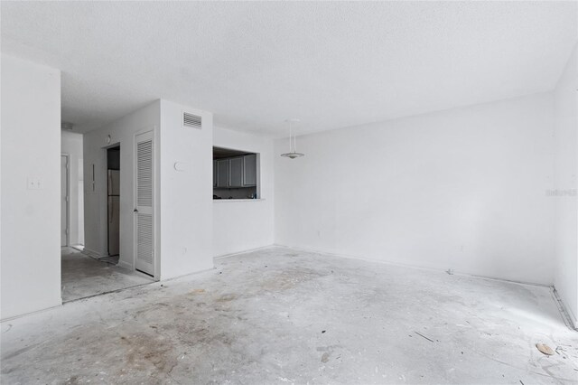 1515 Paul Russell Rd # 64, Tallahassee, FL 32301 - spare room with a textured ceiling
