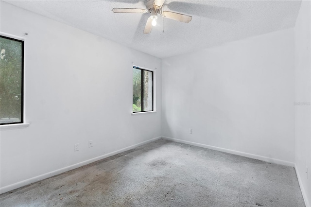 1515 Paul Russell Rd # 64, Tallahassee, FL 32301 - empty room with a textured ceiling, carpet flooring, baseboards, and a ceiling fan