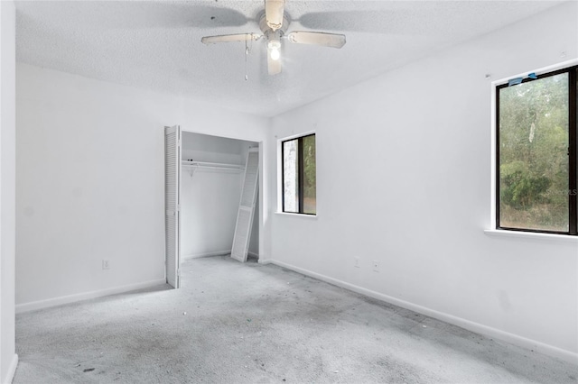 1515 Paul Russell Rd # 64, Tallahassee, FL 32301 - unfurnished bedroom featuring a closet, a textured ceiling, baseboards, and ceiling fan