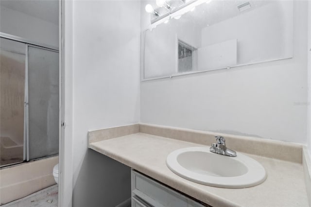 1515 Paul Russell Rd # 64, Tallahassee, FL 32301 - bathroom with vanity, toilet, and enclosed tub / shower combo
