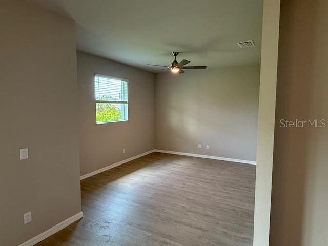 207 Baytree Dr, Rotonda West, FL 33947 - unfurnished room with ceiling fan, baseboards, and wood finished floors