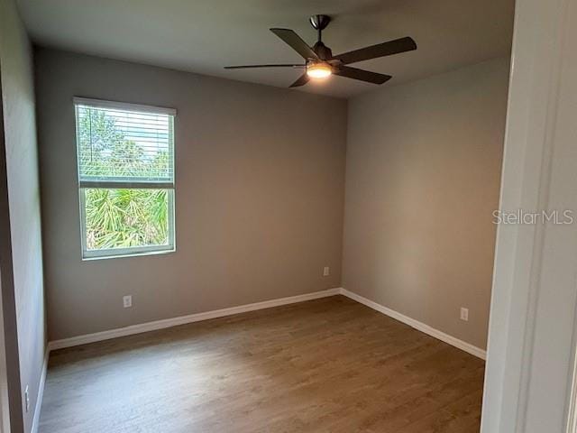 207 Baytree Dr, Rotonda West, FL 33947 - unfurnished room featuring wood finished floors, ceiling fan, and baseboards