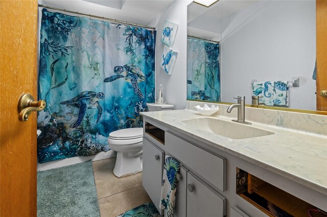 10229 Gulfstream Blvd, Englewood, FL 34224 - bathroom featuring tile patterned floors, vanity, toilet, and a shower with curtain