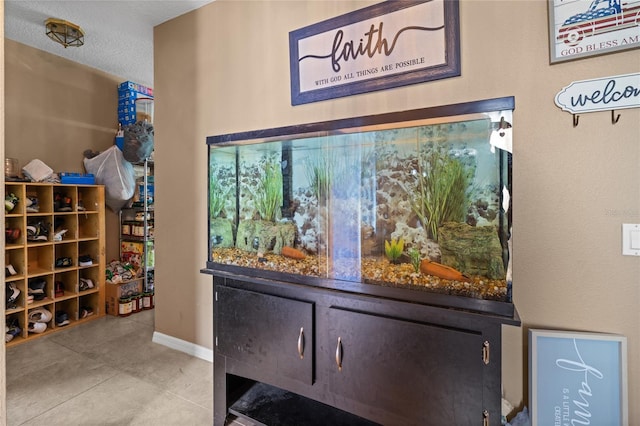 10229 Gulfstream Blvd, Englewood, FL 34224 - wine room featuring light tile patterned floors and baseboards