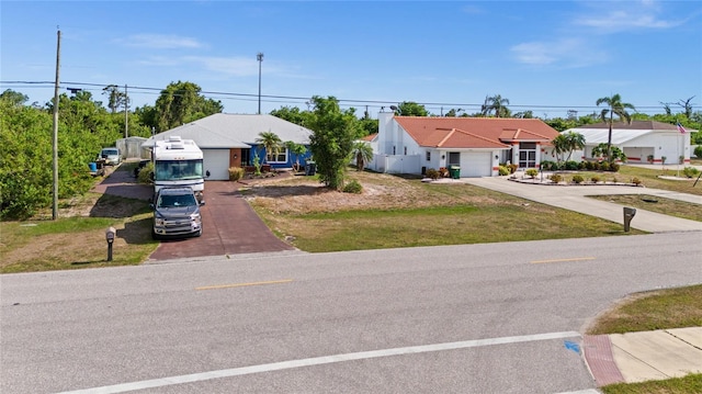 10229 Gulfstream Blvd, Englewood, FL 34224 - view of front of house with concrete driveway and an attached garage
