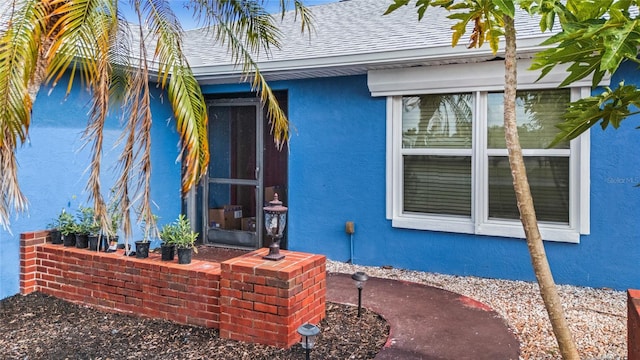 10229 Gulfstream Blvd, Englewood, FL 34224 - back of house featuring stucco siding